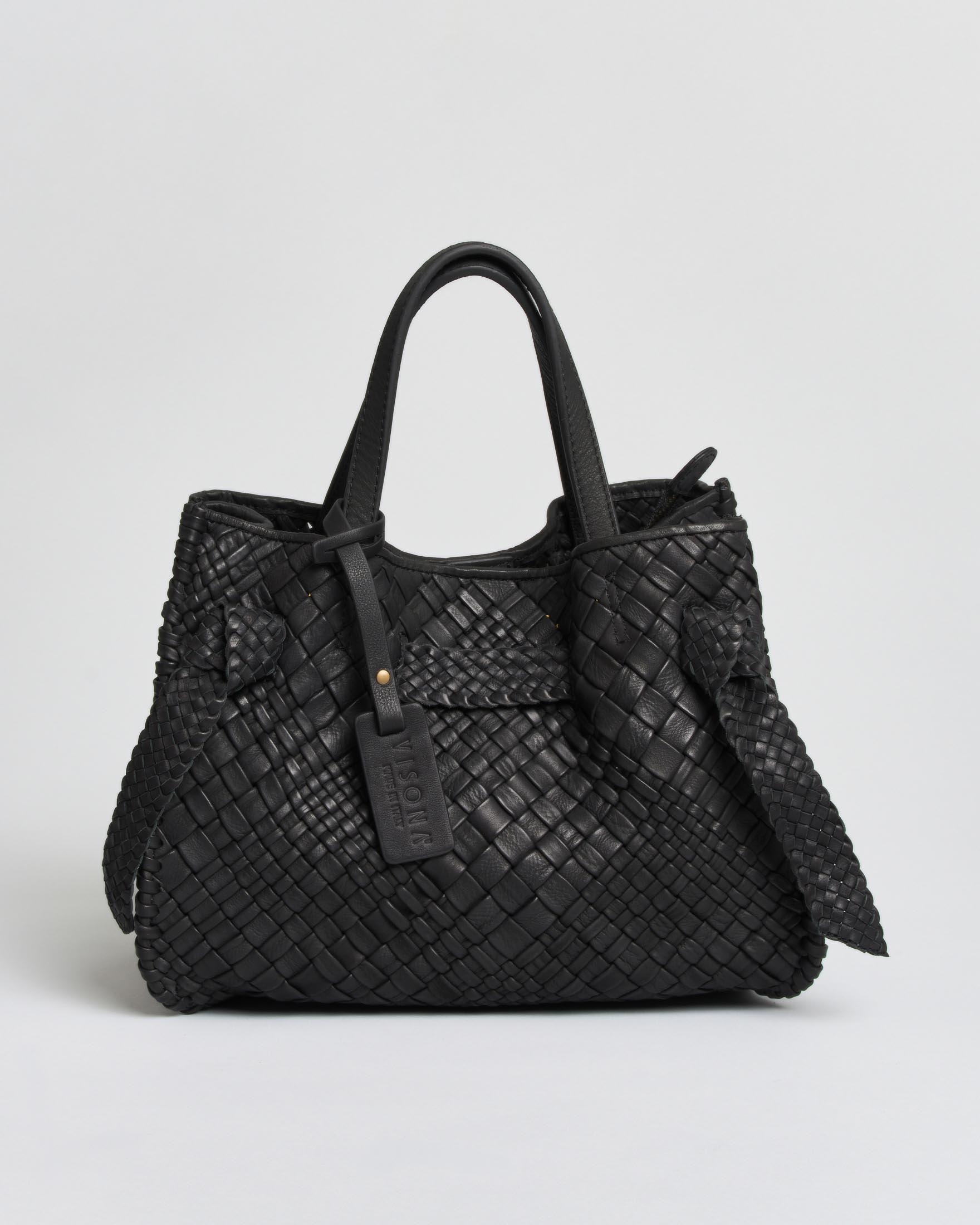 Borsa a mano Esmeralda Visonà nera in pelle morbida intrecciata con tracolla e inserto nodi