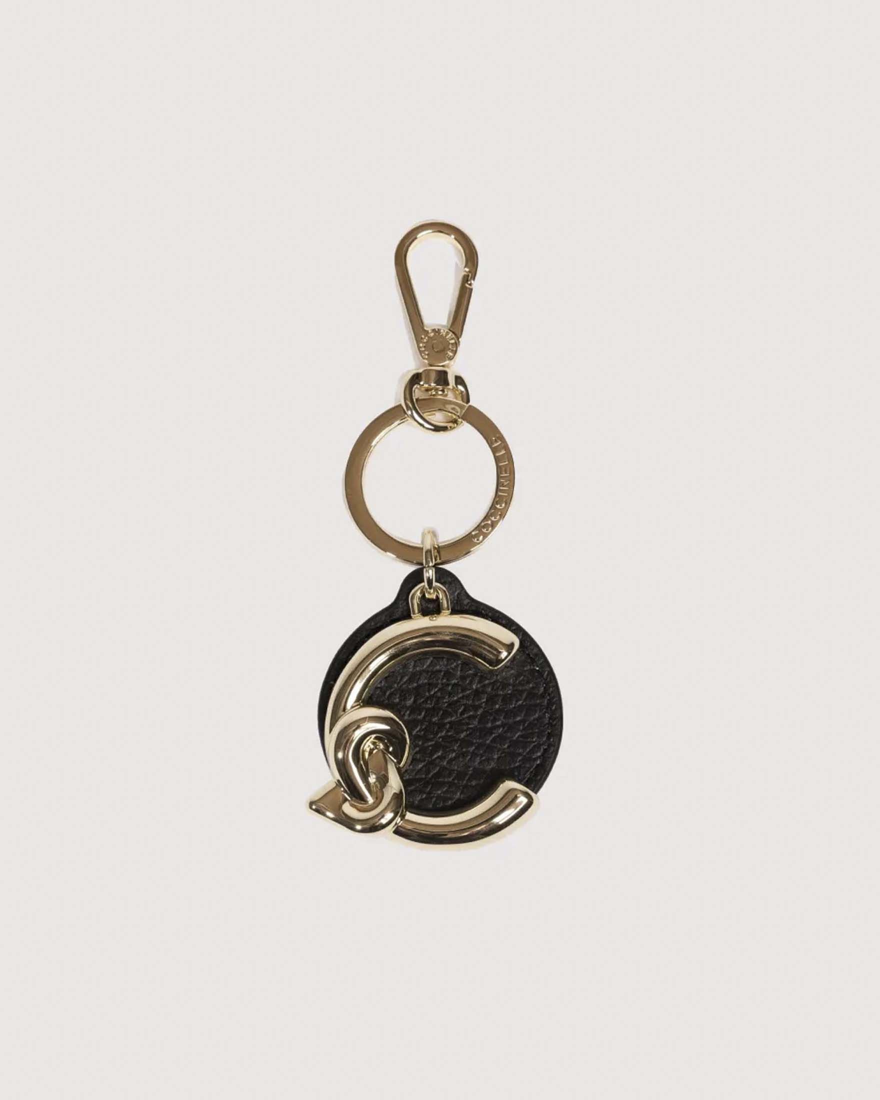 Portachiavi C-Me Coccinelle con tondo in pelle nera e logo dorato