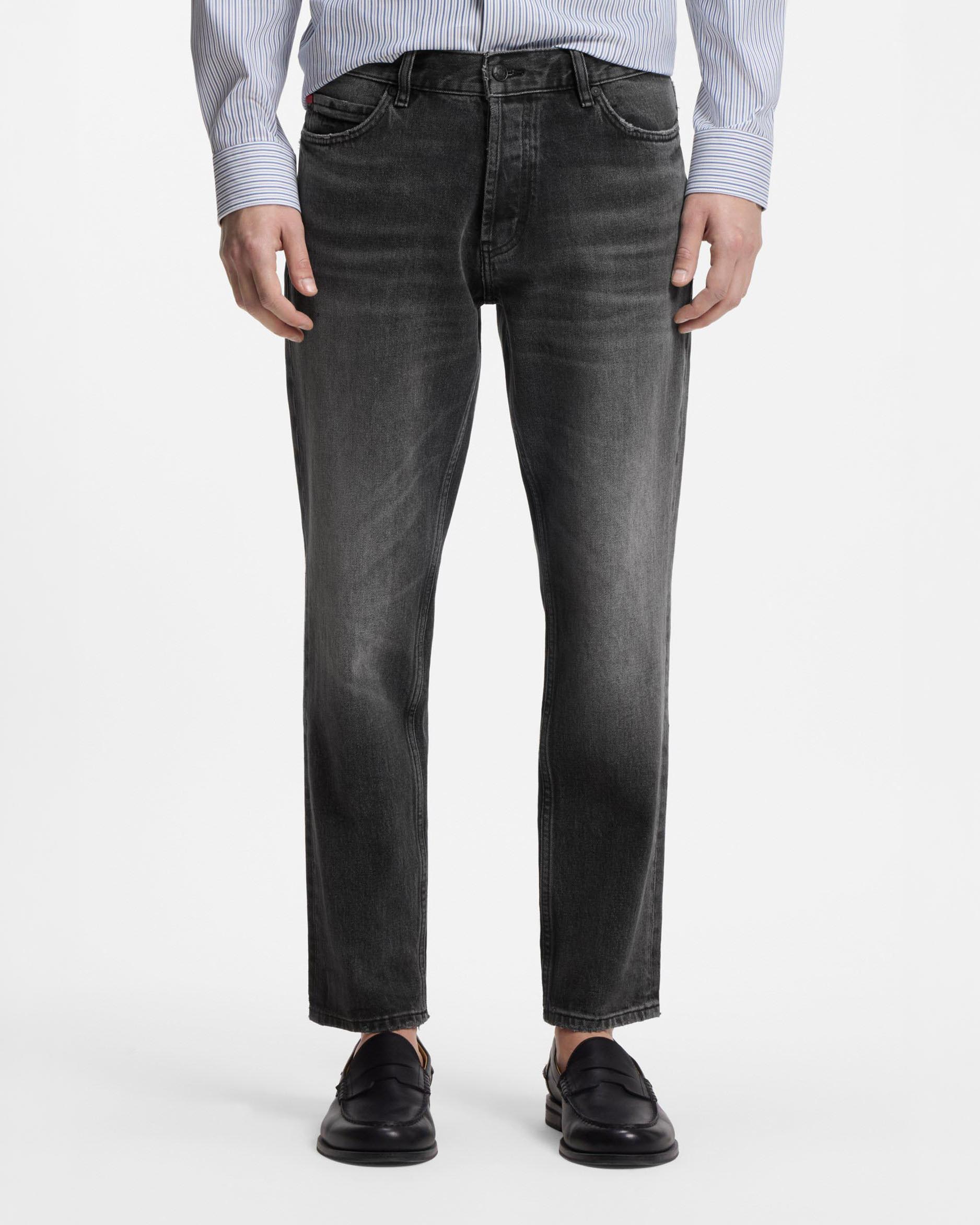 Jeans Hugo tapered fit in denim elasticizzato lavaggio grigio stone washed