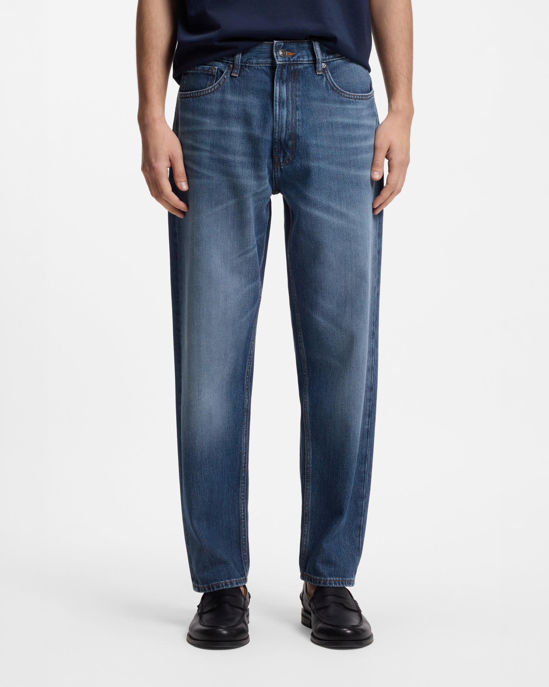 Jeans relaxed tapered fit in denim di cotone lavaggio medio stone washed