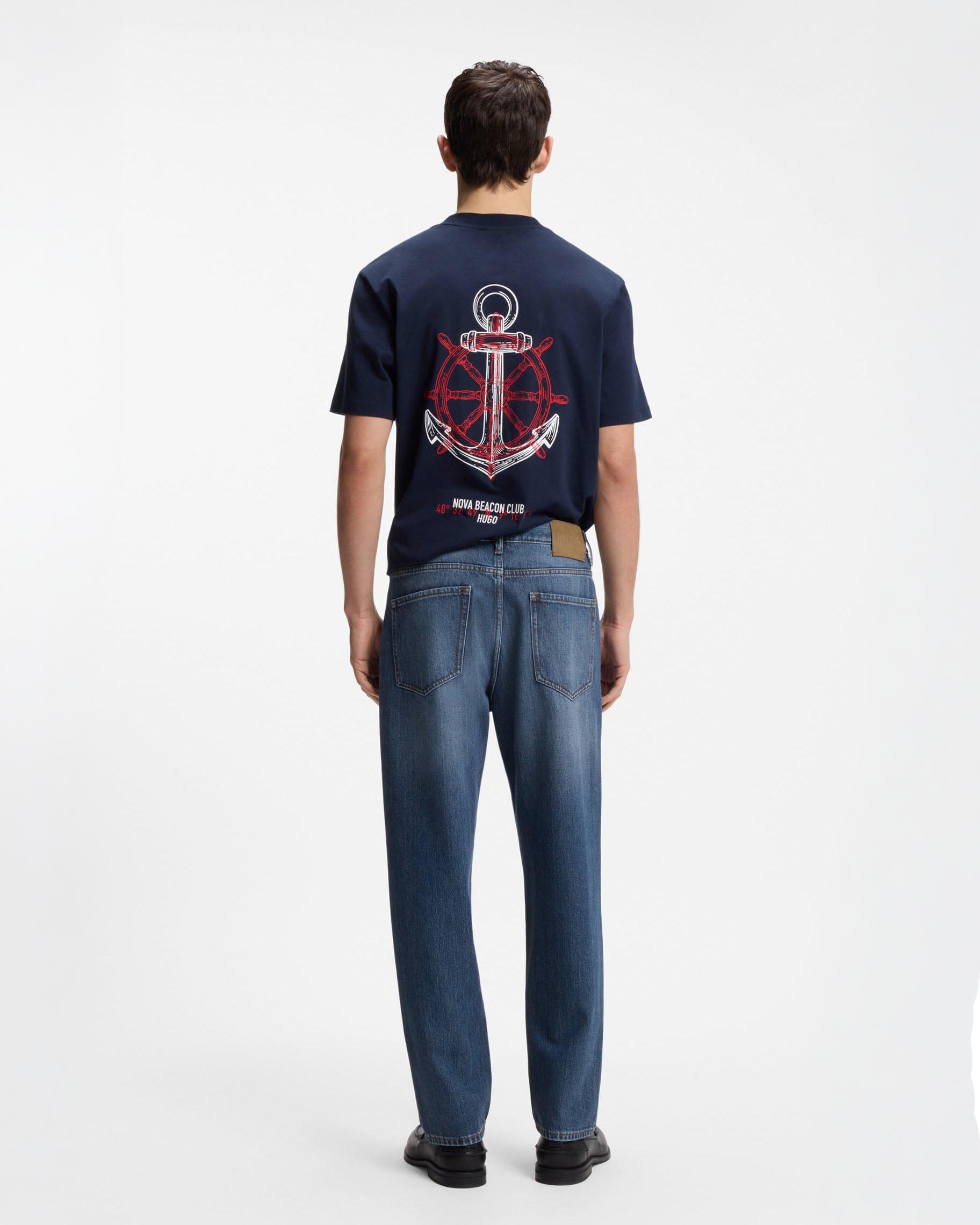 Jeans relaxed tapered fit in denim di cotone lavaggio medio stone washed image