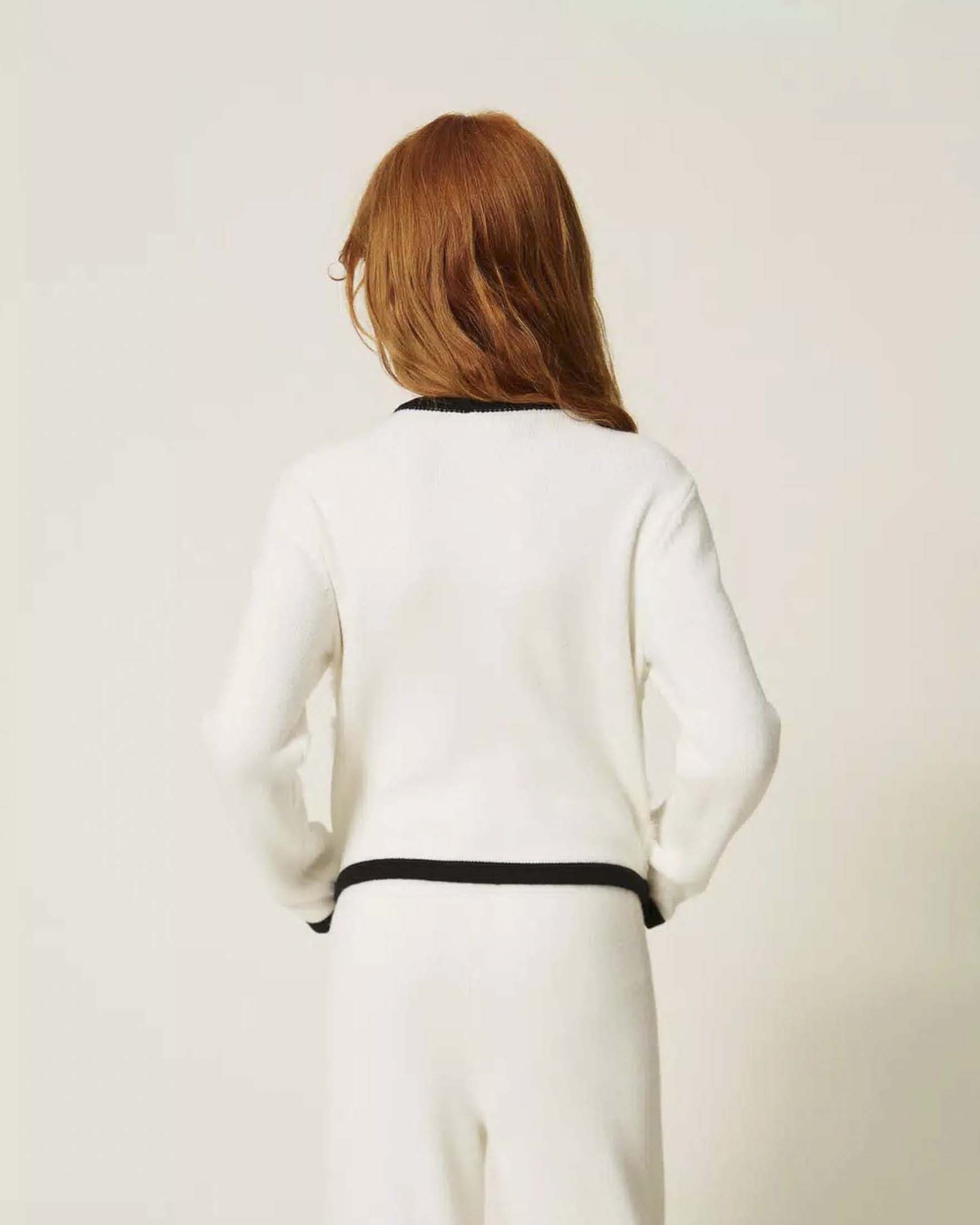 Cardigan Twinset avorio in misto viscosa con lavorazioni e bordi neri image