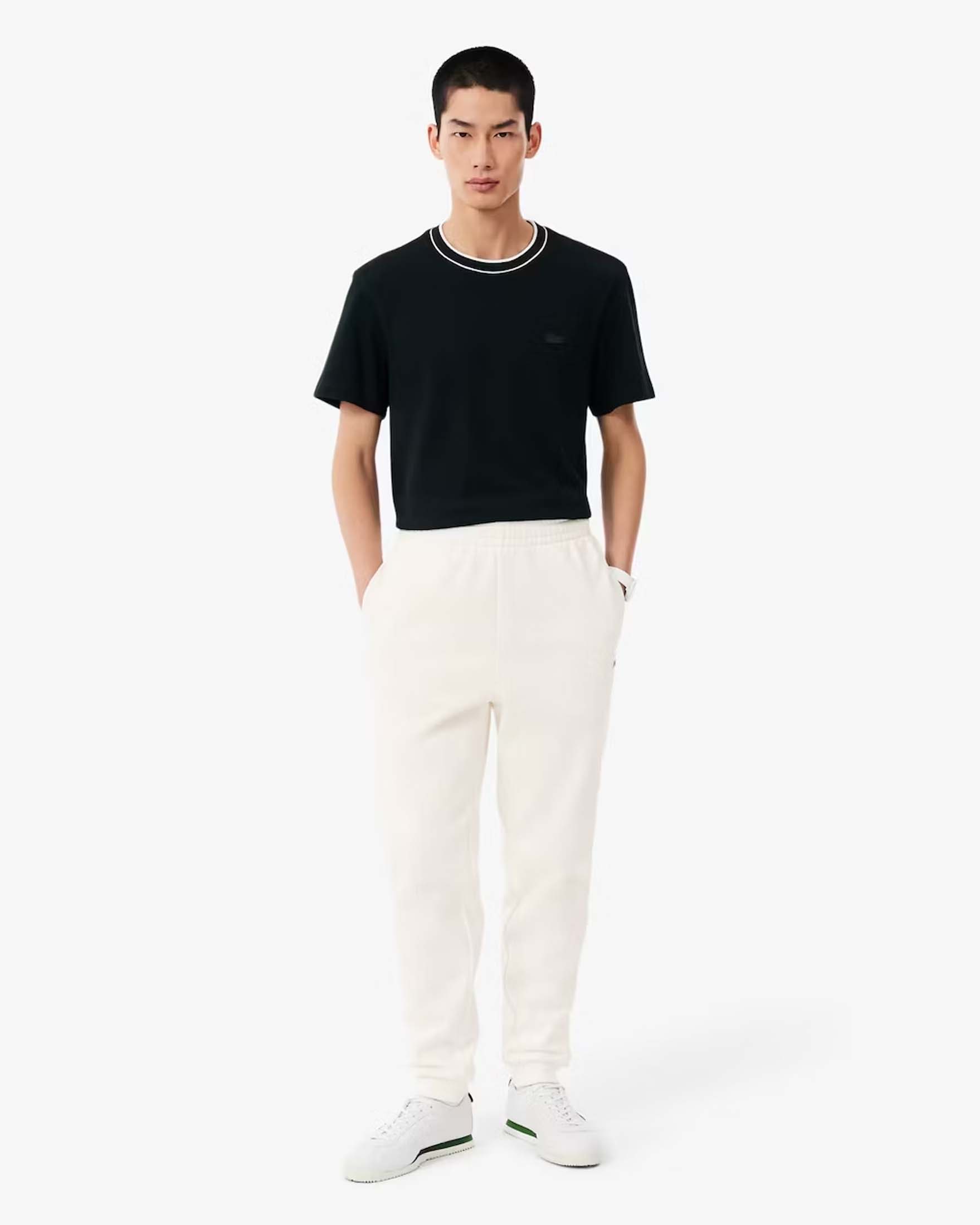 Pantaloni jogger Lacoste panna in cotone felpato