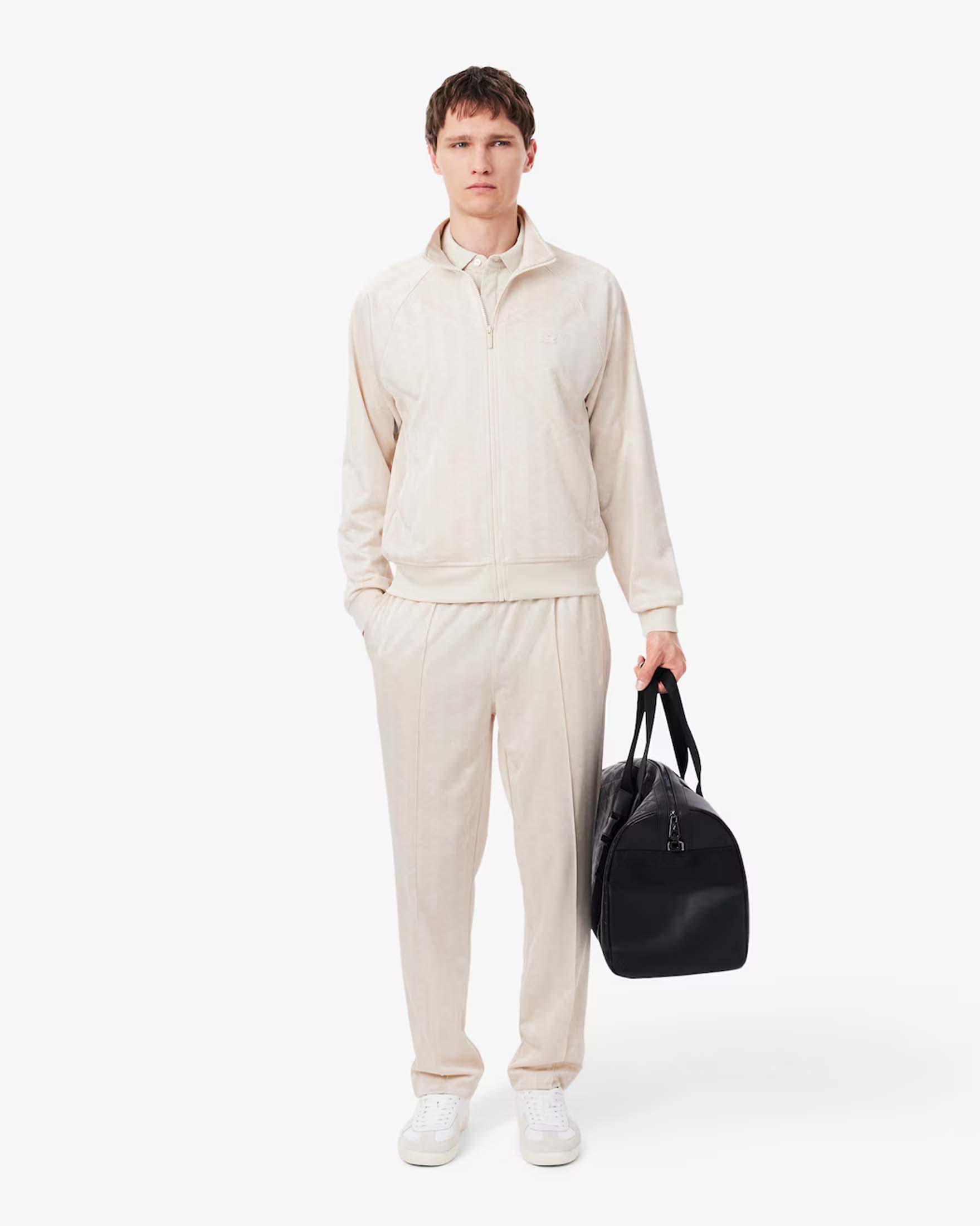 Pantaloni jogger Lacoste panna in tessuto jacquard stretch con monogramma