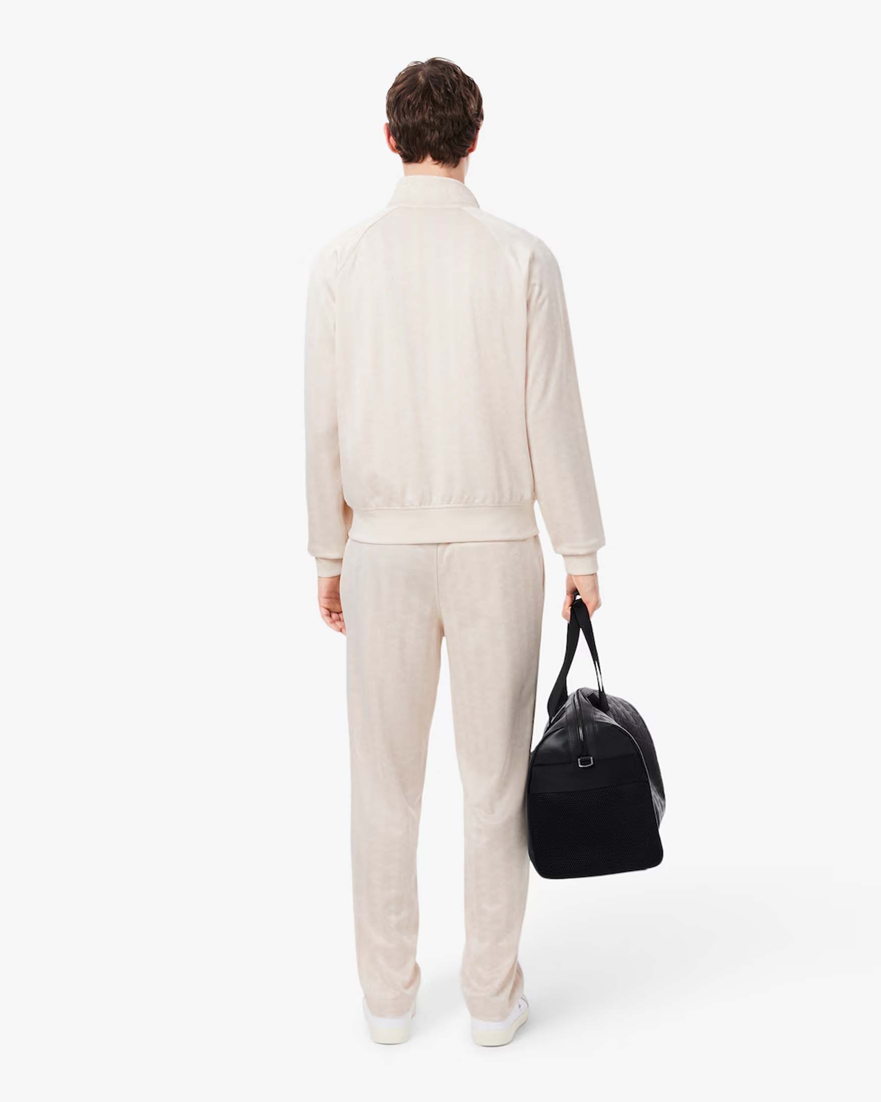 Pantaloni jogger Lacoste panna in tessuto jacquard stretch con monogramma image