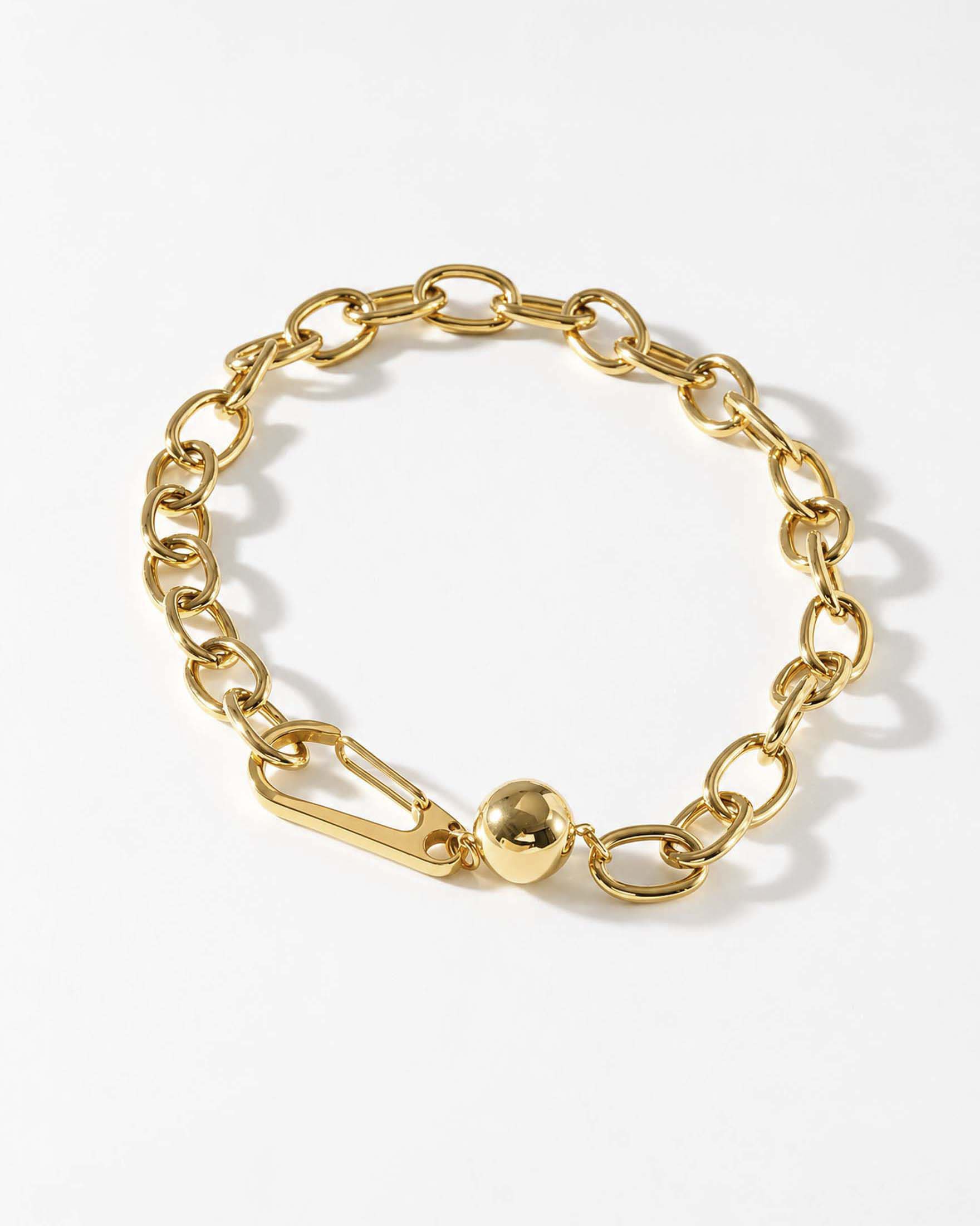 Collana corta Somini dorata a maglie ovali con maxi moschettone e dettaglio bijoux a sfera