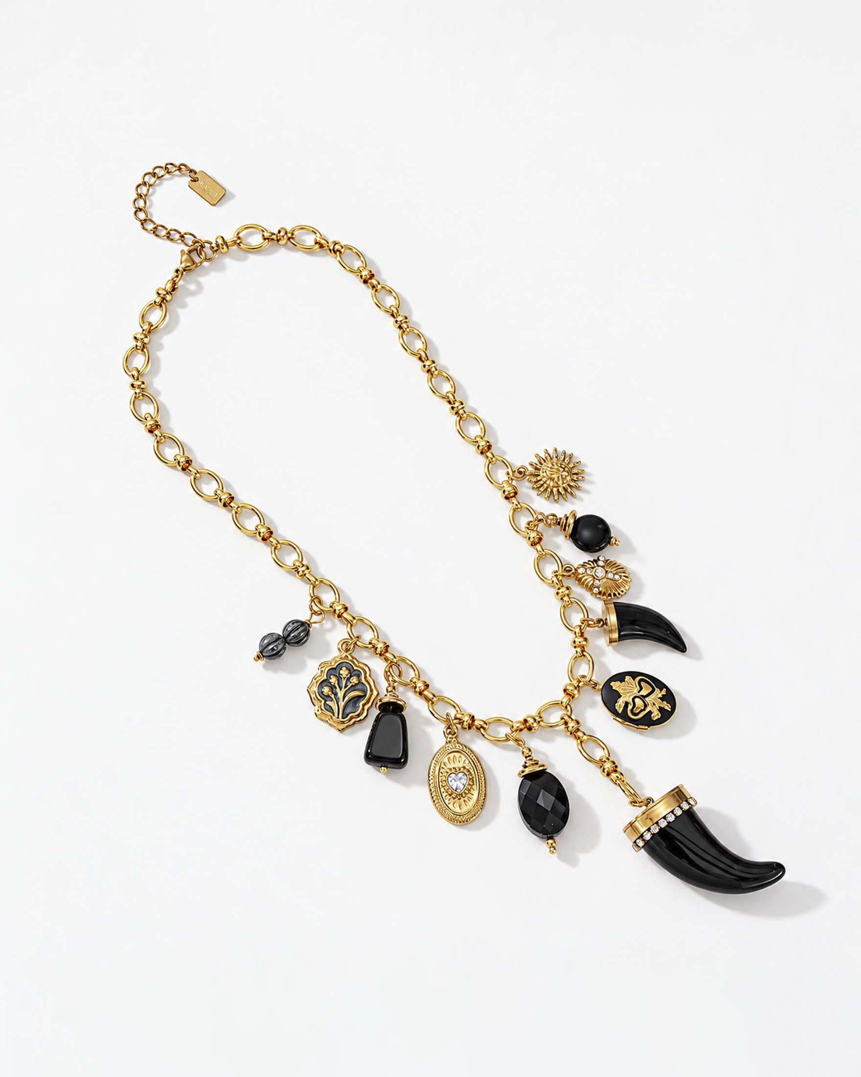 Collana girocollo Somini a catena dorata con corno e altri ciondoli neri