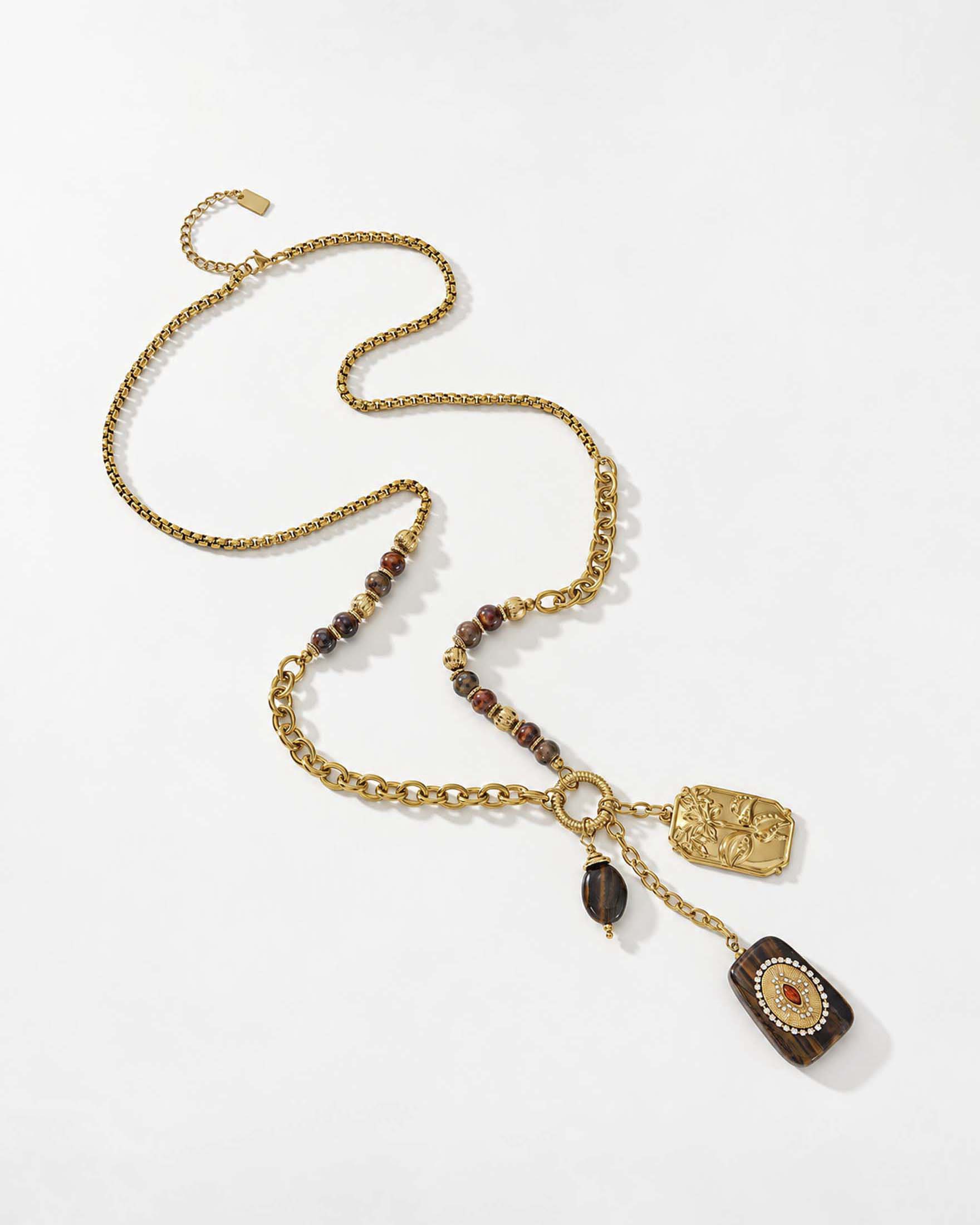Collana Somini dorata con pietre marroni e ciondoli decorativi
