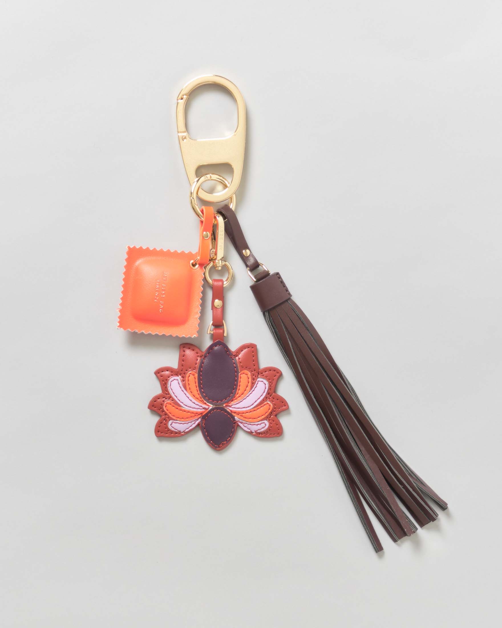 Portachiavi My Best Bag oro con nappina marrone e charms a tortello arancione e fiore rosso